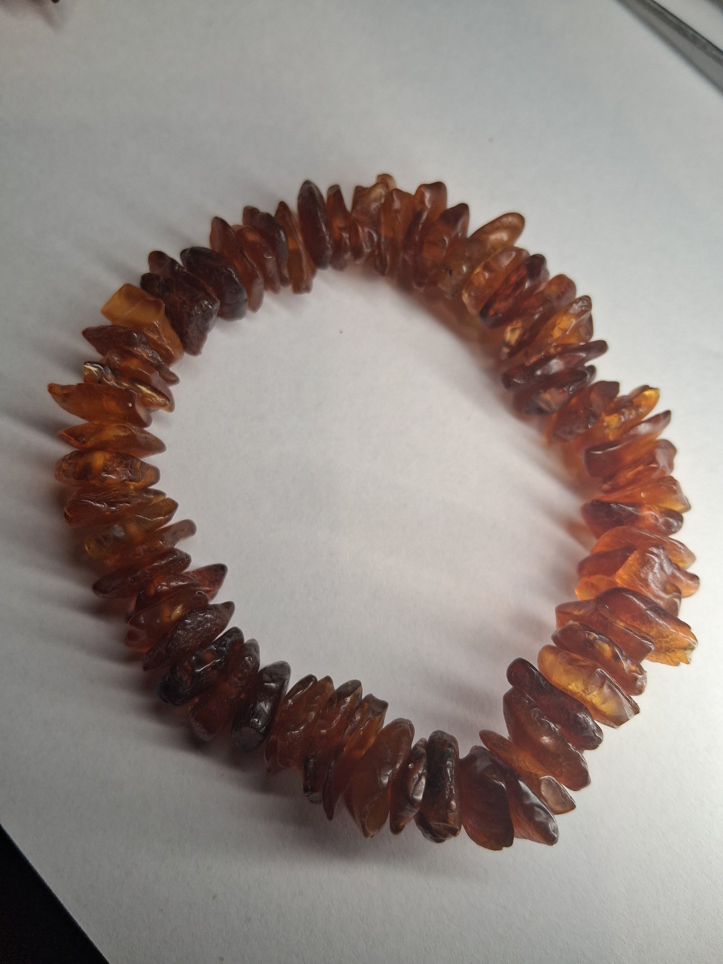 Brown beaded bracelet on a white background