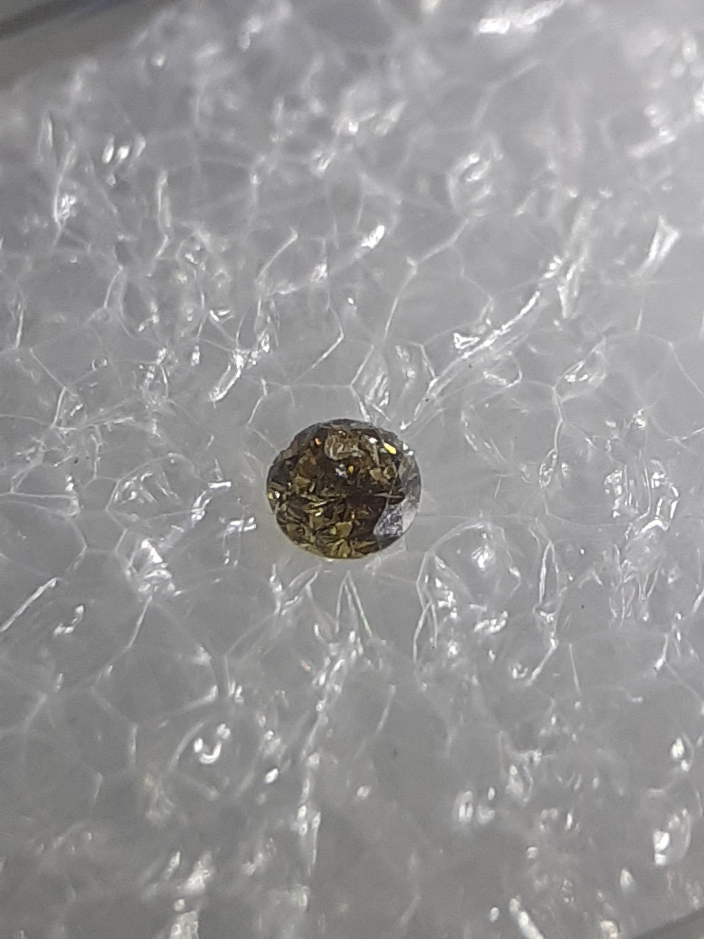 Certified Natural Diamond - Round Brilliant - 0.03ct - I2 - Natural Fancy Intense Brownish Yellow - sealed - Natural Gems Belgium