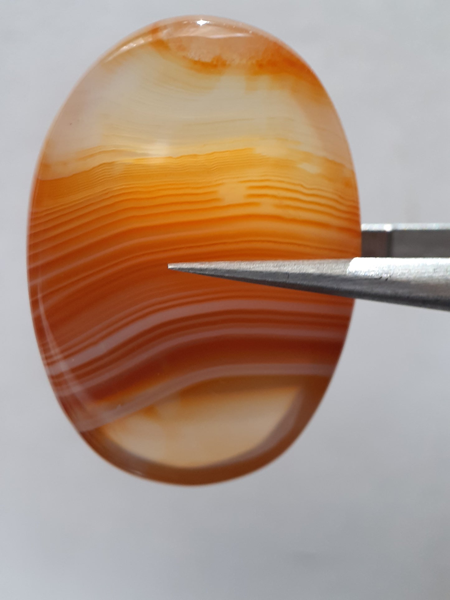 Natural orangy red Lake Superior Agate - 37.78 ct - oval Cabochon - unheated - certified by NGB - Natural Gems Belgium