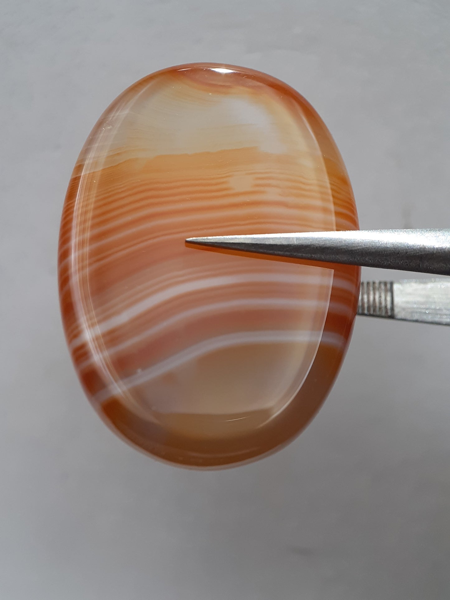 Natural orangy red Lake Superior Agate - 37.78 ct - oval Cabochon - unheated - certified by NGB - Natural Gems Belgium