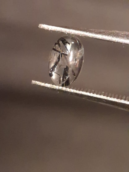 Natural Rutilated Quartz - oval cabochon - black rutile quartz - 0.475 ct