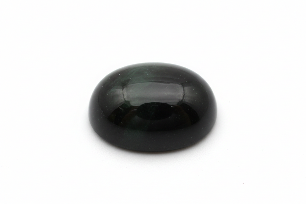 black diopside cabochon oval shaped white background