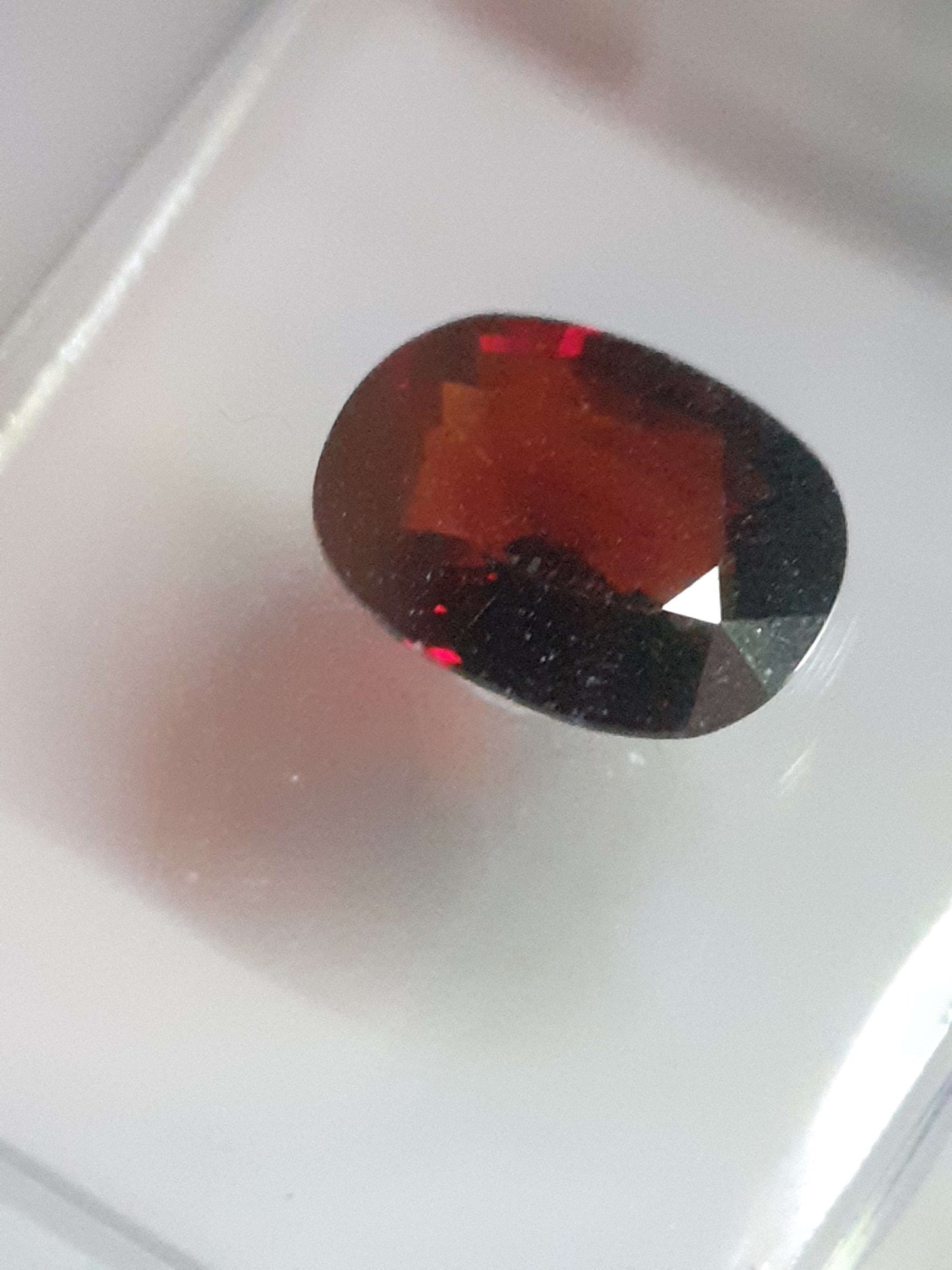 Certified orangy red Spessartite Garnet - 1.17 ct oval  - Sealed - Natural Gems Belgium