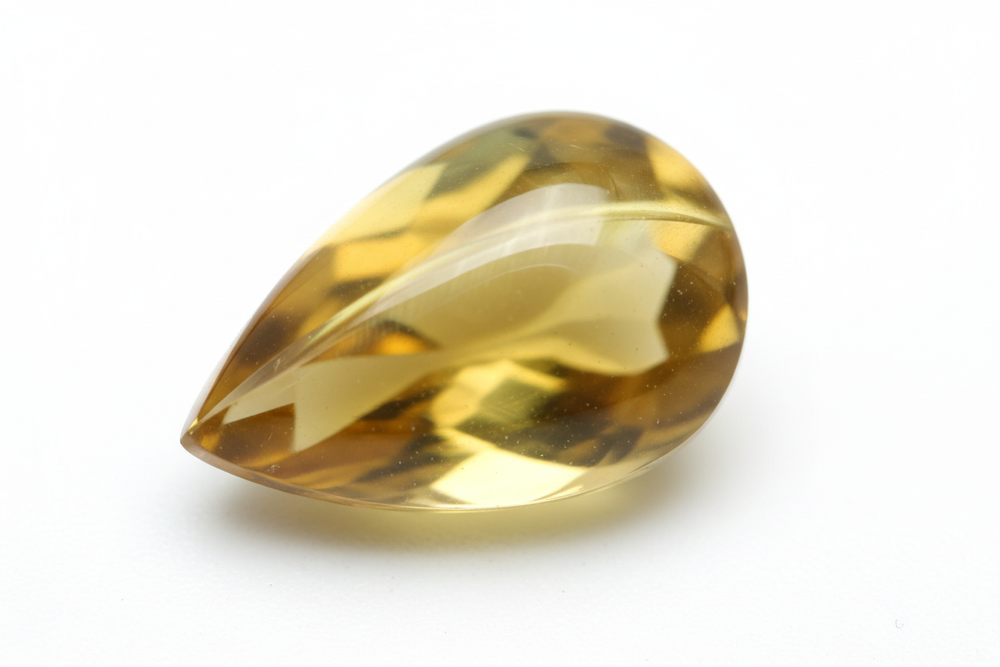 chrysoberyl cabochon pear shaped white background