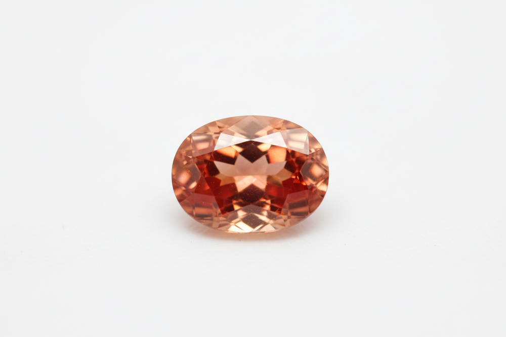 Faceted Malaya Garnet Oval Cut white background