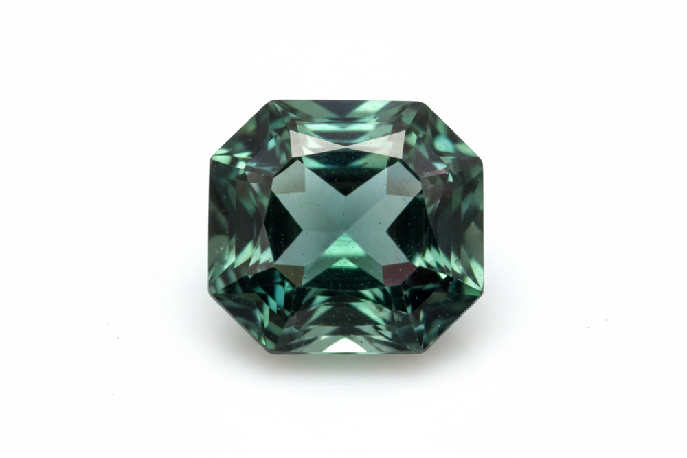 faceted Tourmaline gemstone octagon cut white background
