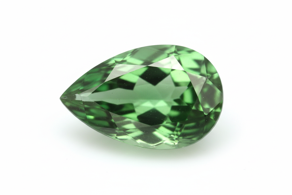 faceted tsavorite garnet pear shaped white background