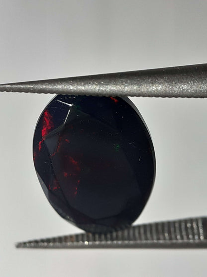 Natural Black Crystal Opal - play of color - 1.892 ct - oval - smoked