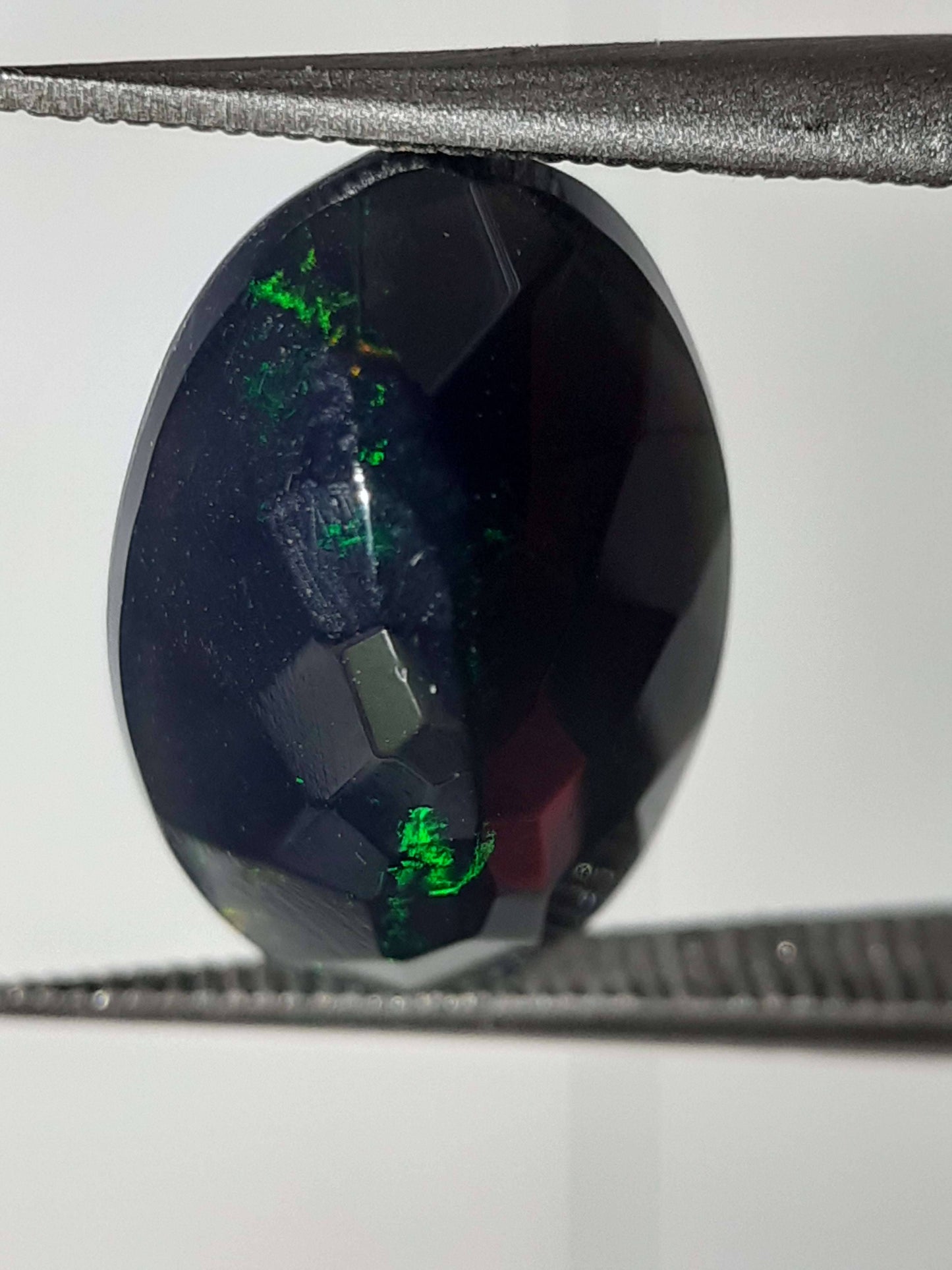 Natural Black Crystal Opal - play of color - 1.892 ct - oval - smoked