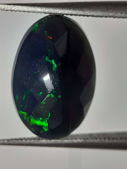 Natural Black Crystal Opal - play of color - 1.892 ct - oval - smoked