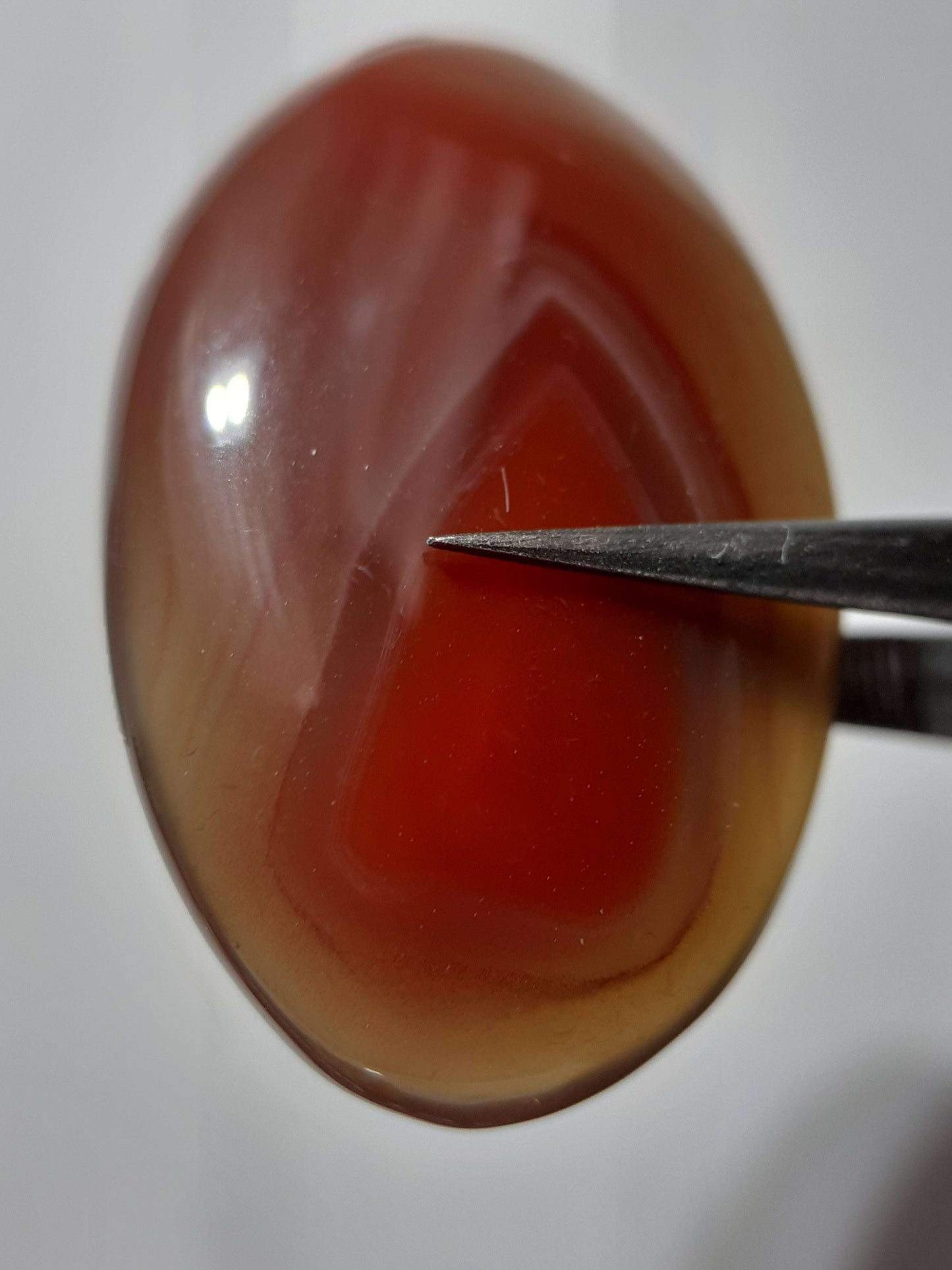 Natural brownish red Botswana Agate - 24.46 ct - oval Cabochon - unheated - certified by NGB