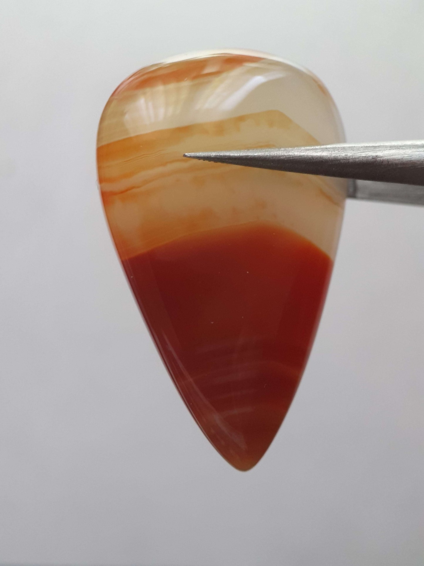 Natural deep brownish red and orange Lake Superior Agate - 23.96 ct - pear Cabochon - unheated - certified by NGB