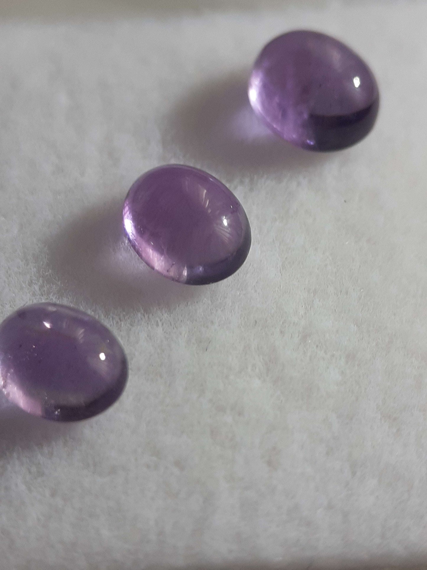 Natural light to medium purple Amethyst - set of 3 - 1.09 tcw - oval cabochon - approx 5 x 4 mm - unheated