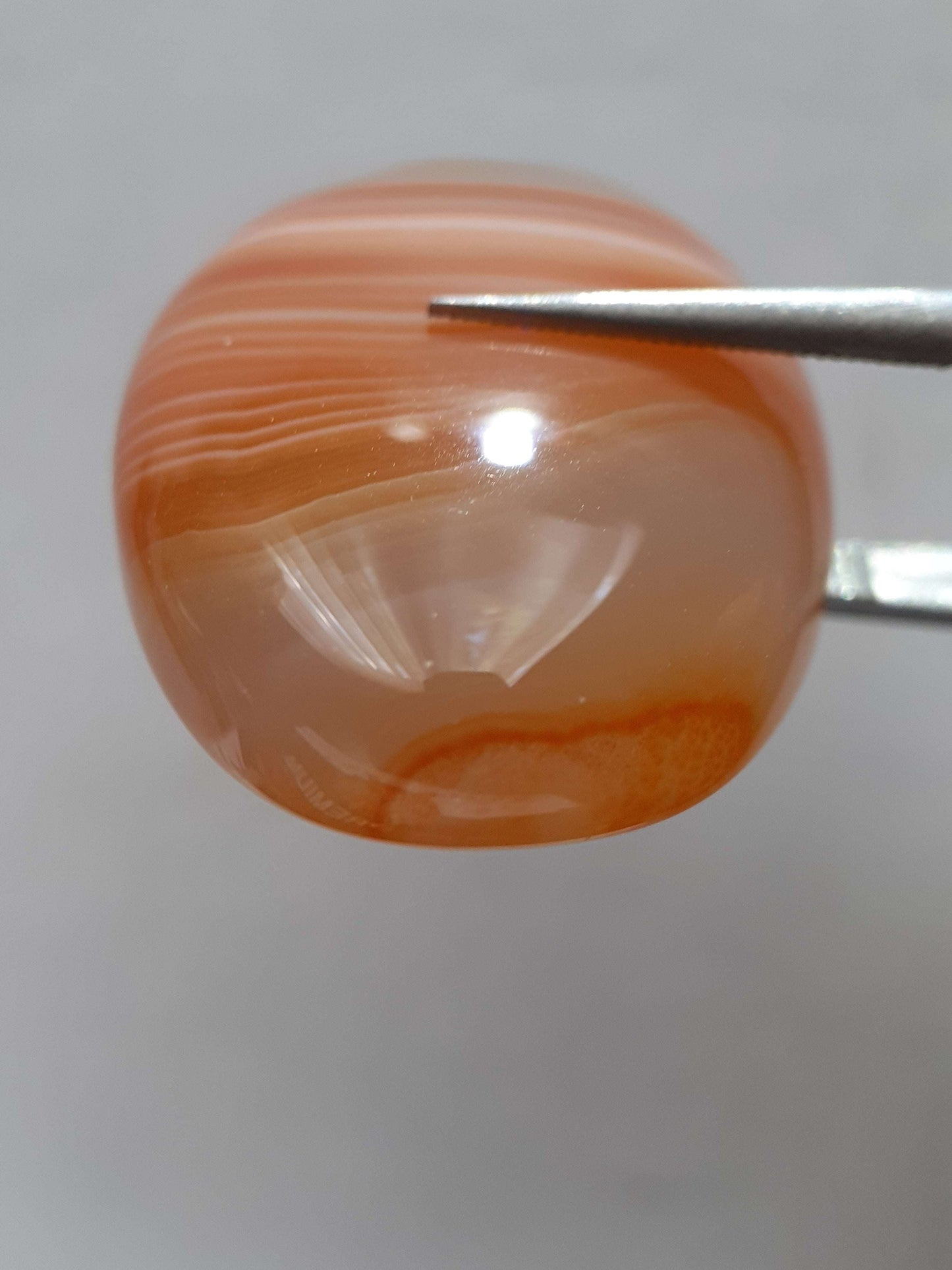 Natural orangy red Lake Superior Agate - 37.78 ct - oval Cabochon - unheated - certified by NGB