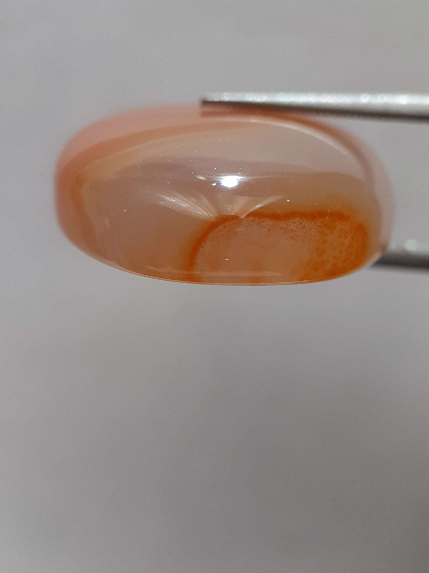 Natural orangy red Lake Superior Agate - 37.78 ct - oval Cabochon - unheated - certified by NGB