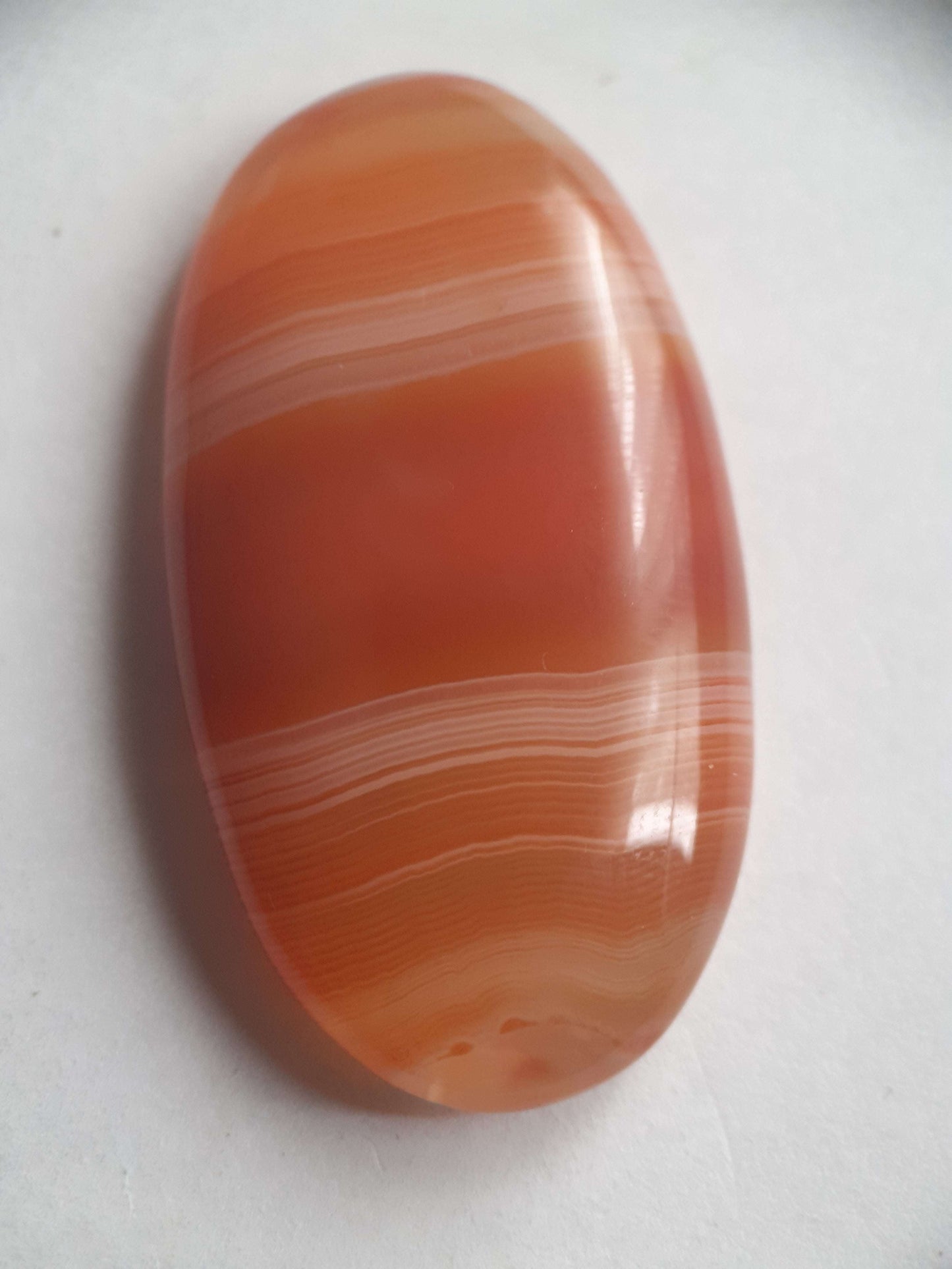 Natural orangy red Lake Superior Agate - 48.53 ct - long oval Cabochon - unheated - certified by NGB