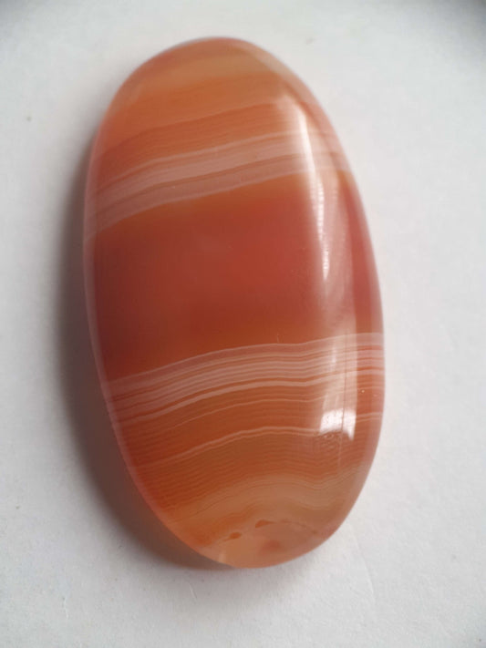 Natural orangy red Lake Superior Agate - 48.53 ct - long oval Cabochon - unheated - certified by NGB