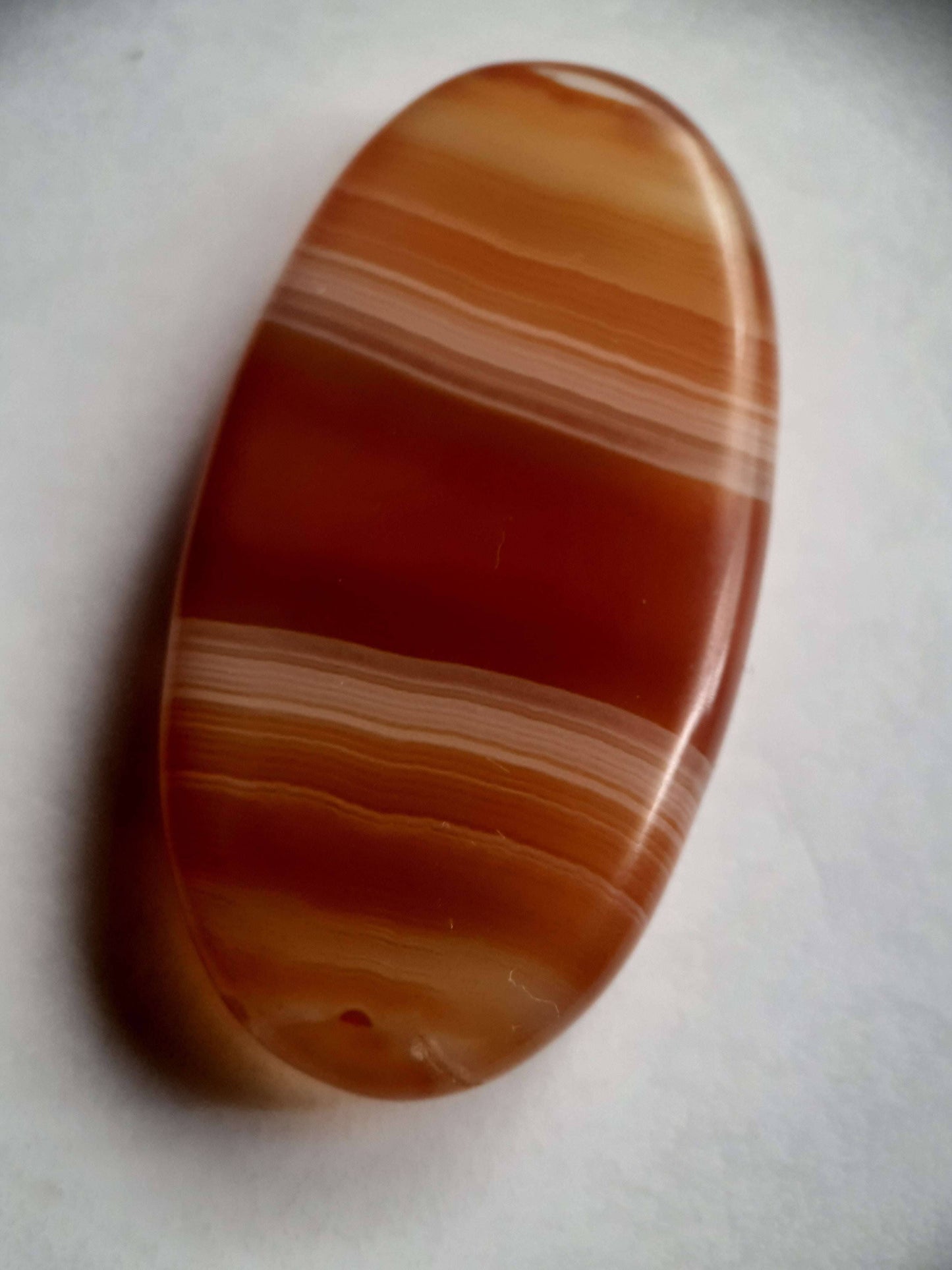 Natural orangy red Lake Superior Agate - 48.53 ct - long oval Cabochon - unheated - certified by NGB