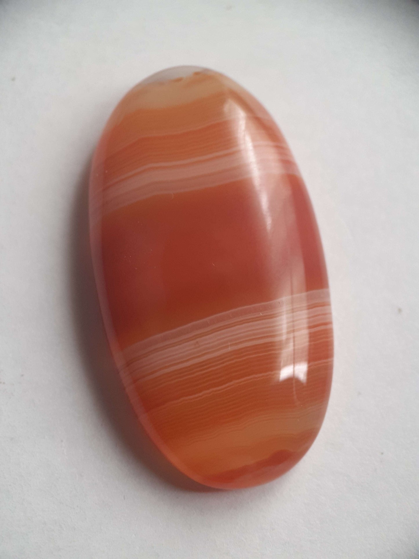 Natural orangy red Lake Superior Agate - 48.53 ct - long oval Cabochon - unheated - certified by NGB