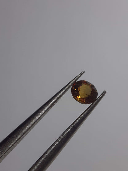 Natural orangy Yellow Sapphire - 0.34ct - round - Beryllium treated - Certified by NGB - Natural Gems Belgium