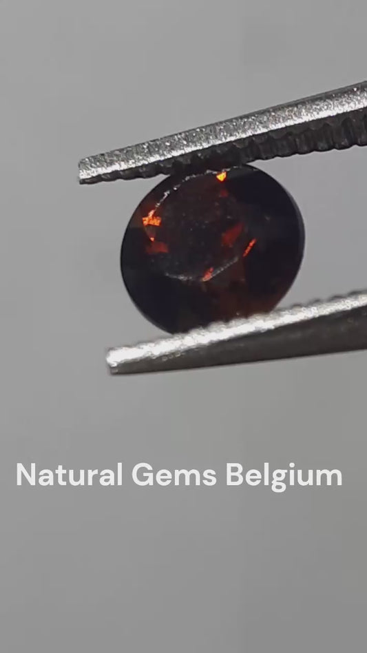 Natural orangy reddish brown zircon - 0.35 ct - round - unheated - certified by NGB