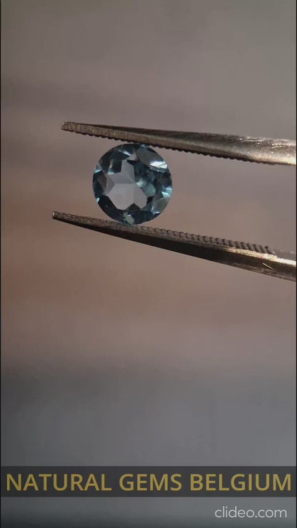 Natural Swiss Blue Topaz - 0.580 ct - round - irradiated - AAA grade - certified natural.